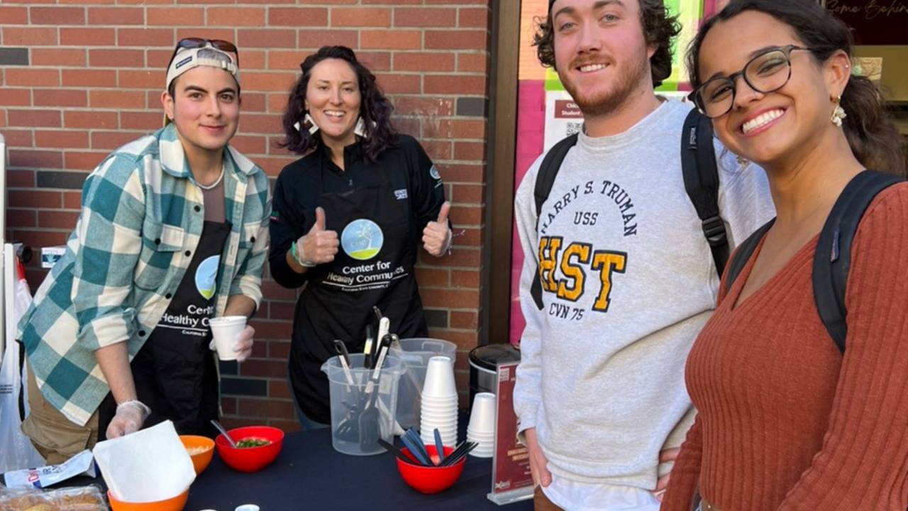Chico State students and staff at a food tasting event on campus near the Wildcat Food Pantry.